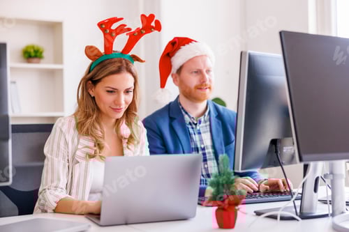 Preview: Business colleagues working at the office for Christmas