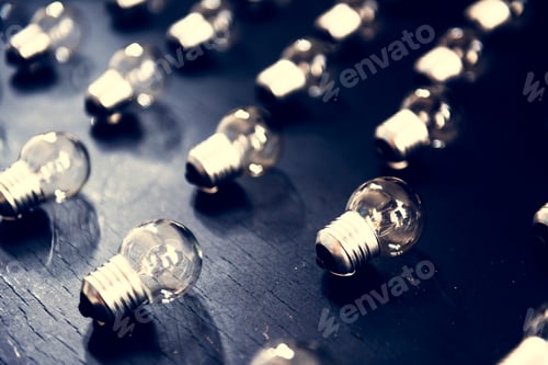 Preview: Lightbulbs on black textured table