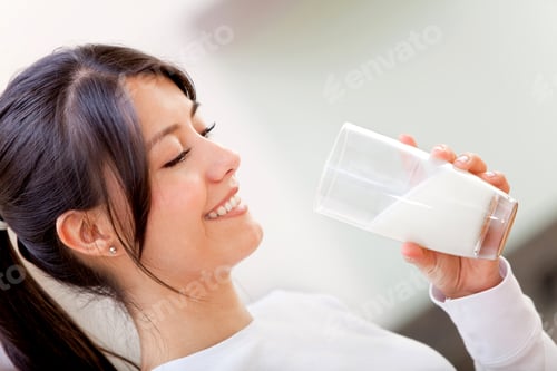 Preview: Beautiful Woman Drinking Milk And Then Smiling