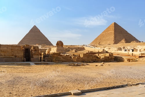 Preview: Majestic pyramids of Giza under a clear blue sky in the afternoon sun