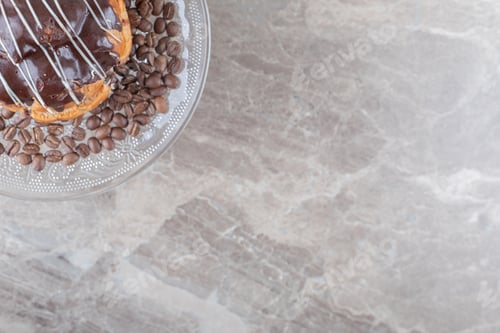 Preview: Glass platter with coffee beans chocolate coated cake on marble background