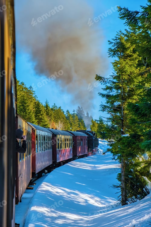 Preview: Steam train during winter in the snow in the Harz Germany Brocken Bahn