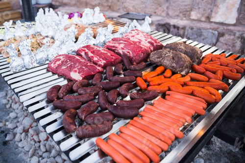Preview: Enormous amount of meat on a barbeque (bbq) with sausages and Argentinian steak, Atacama Desert, Chi