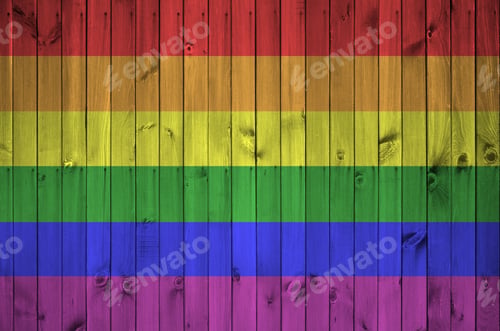 Preview: LGBT community flag depicted in bright paint colors on old wooden wall close up