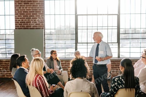 Preview: People sitting and talking with a group