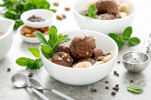 Preview: Chocolate and banana fruit ice cream with almond nuts served in bowls