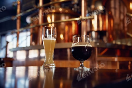 Preview: Two cold glasses of beer are comfortably sitting on a bar counter
