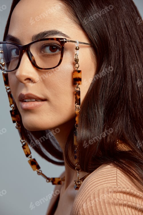 Preview: Portrait of a beautiful brunette woman in glasses close-up, attractive woman in stylish glasses on a