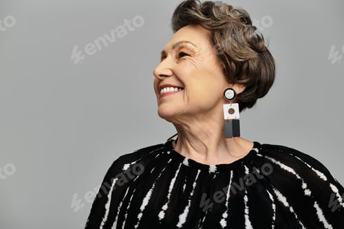 Preview: A stylish woman in her 60s showcases her elegance with a joyful expression, dressed beautifully.