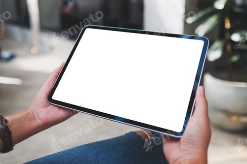 Preview: Mockup image of a woman holding digital tablet with blank white desktop screen in cafe