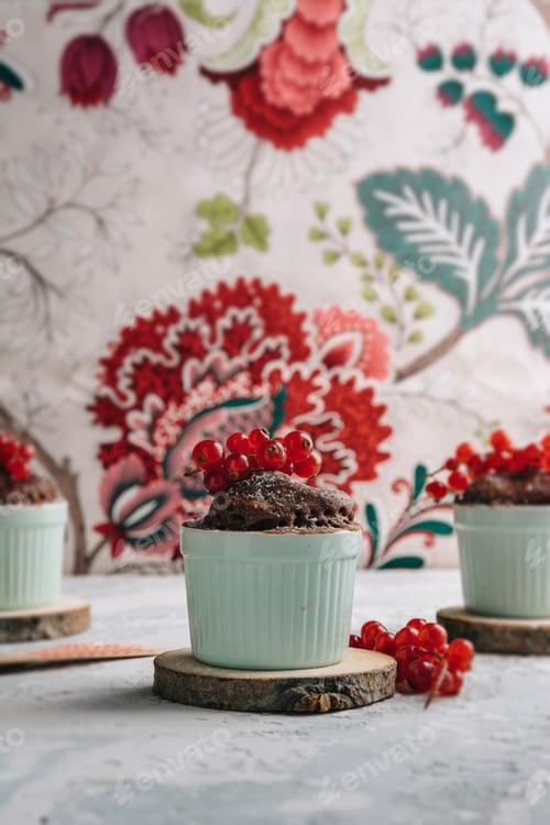 Preview: Three Chocolate cakes in the cup with currants and sugar glass.