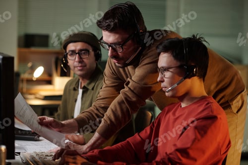 Preview: Caucasian Man Supervising Young Adult Men Operating Call Center