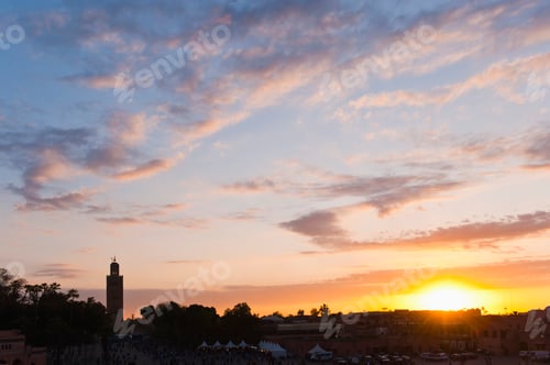 Preview: Koutoubia Mosque minaret silhouetted at sunset, taken from Place Djemaa El Fna Square, Marrakech (Ma