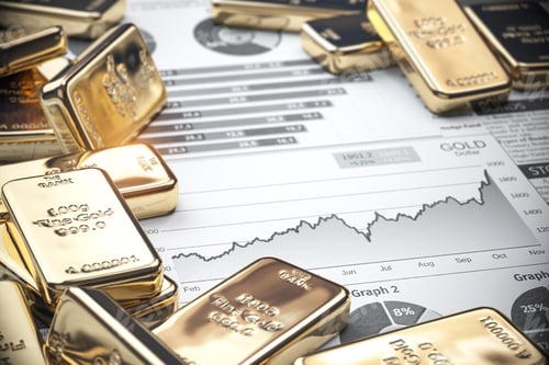 Preview: Growth of gold on stock market concept. Gold bar and ingots on chart of financial report.