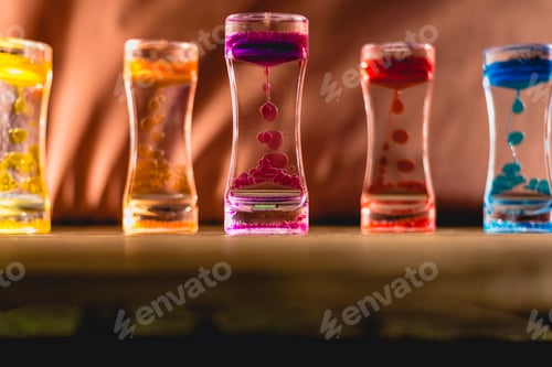 Preview: Toy with water and drops of oil colors.