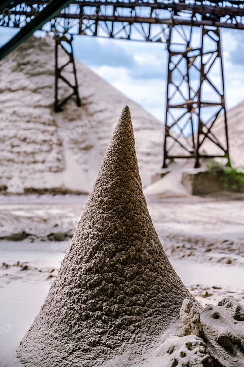 Preview: Vertical shot of a cone-like sand pile