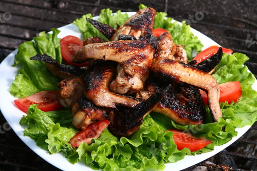 Preview: chicken legs on the grill with vegetables