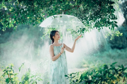 Young Woman with Umbrella in Dreamy, Green Forest