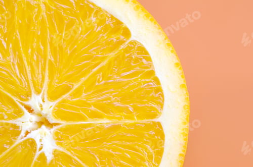 Preview: Top view of a one orange fruit slice on bright background in orange color