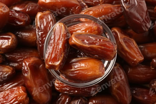 Preview: Tasty sweet dried dates and glass bowl, top view