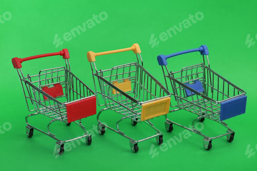 Preview: Row of empty shopping trolleys on color background