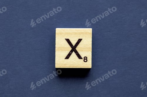 Preview: Letter X on a wooden cube from a wordplay board game