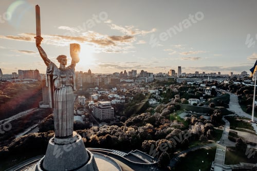 Preview: aerial view of Motherland Monument. Drone pic with sun flares. Monumental statue in the capital.