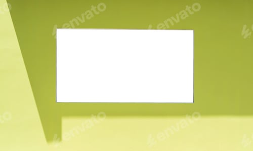 Preview: Green wall outside building with empty square frame and shadow light well free space for text