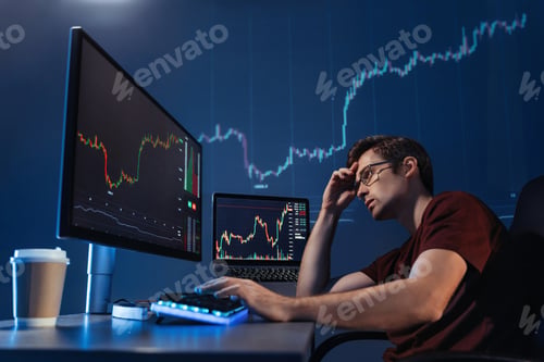 Preview: Crypto investor looking at computer screen with candlestick chart, upset with global recession