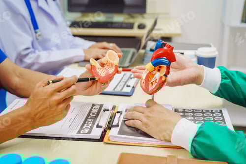 Preview: Doctors meet at a hospital desk to discuss a patient’s heart health, including conditions like
