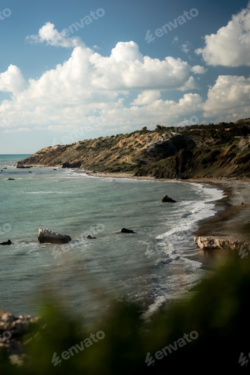 Preview: Rocky beach with the cape and beautiful blue sea water