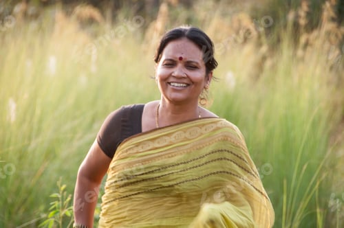Preview: Happy Indian woman running in the meadow, Woman enjoying nature.
