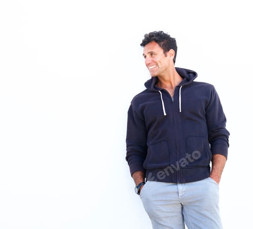 Preview: Smiling mature man standing against white background