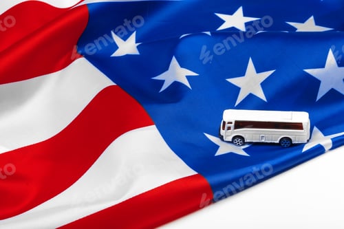 Preview: toy bus and US flag