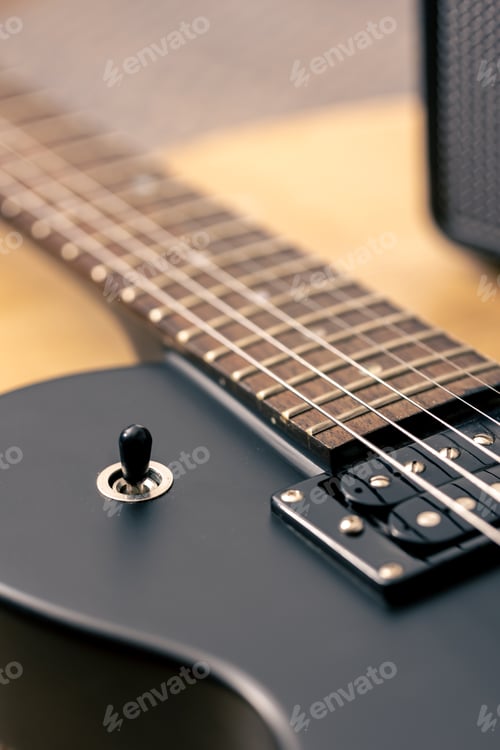 Preview: Photo of details of an electric guitar close up.