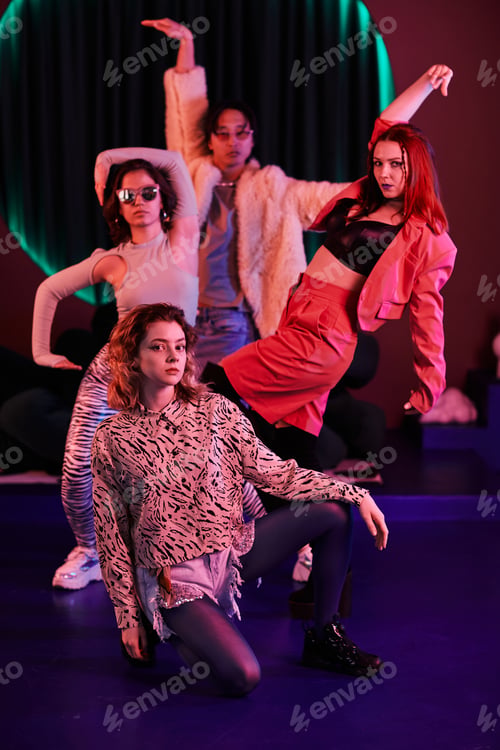 Preview: Dance Team Posing in Red Neon