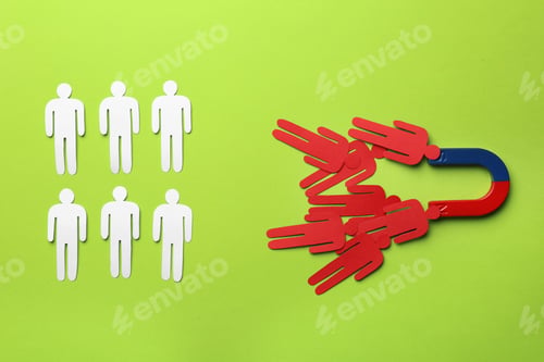 Preview: Magnet attracting paper people on color background, flat lay. Marketing concept