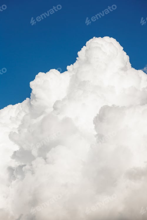 Preview: white cumulus clouds in blue sky, beautiful view of the sky and storm clouds. Huge majestic cloud