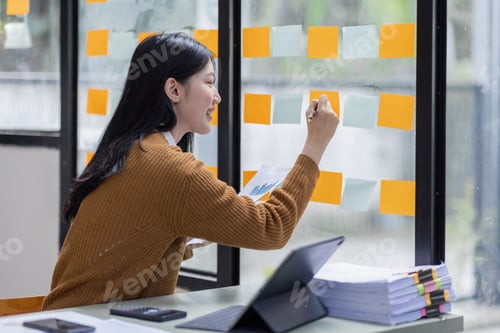 Preview: Young Business Asian woman working in Stacks of paper files for searching information on desk office