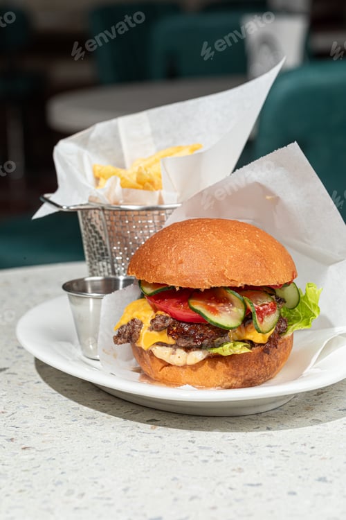 Preview: Delicious Burger with Fries on Restaurant Table