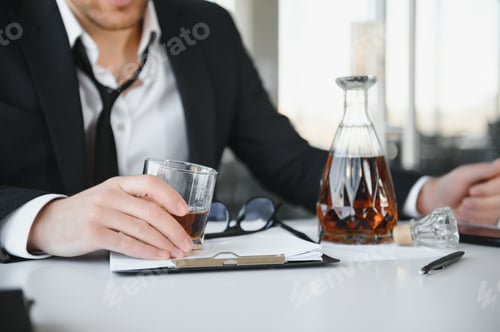 Preview: Alcoholism at work. Tired employee drinking alcohol at workplace, can not handle stress.