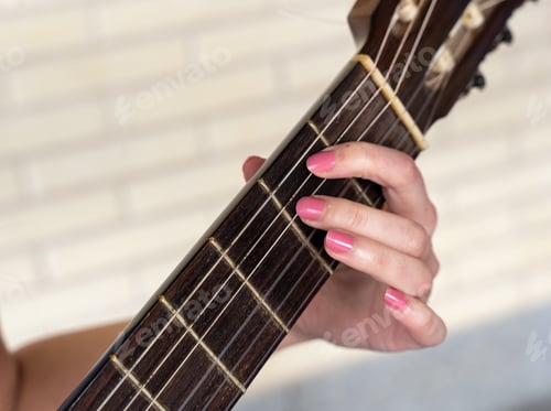 Preview: Crop female musician playing guitar