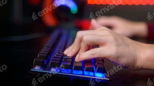 Preview: Close up human hand is playing Online Game computer in home