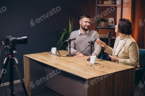 Preview: Two content creators recording a podcast episode in a professional studio, discussing