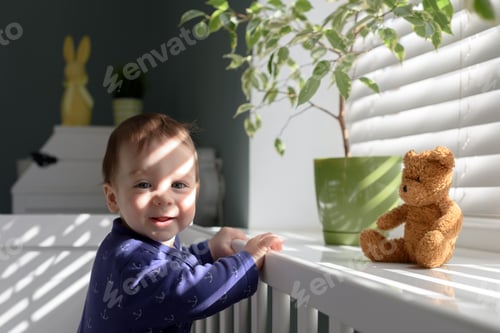 Preview: Smiling kid near window
