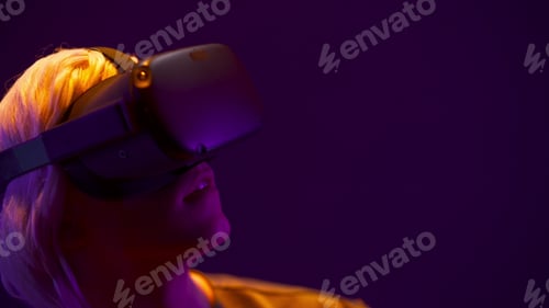 Preview: Spellbound man using augmented reality glasses closeup. Entertainment concept