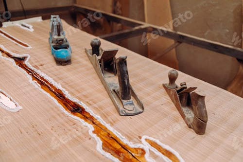 Preview: Old jointer planes laying on wood table