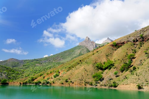 Preview: Lake with azure water located among mountains