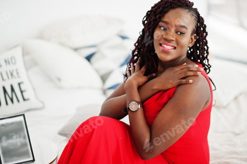 Preview: Magnificent young african woman in luxurious red dress