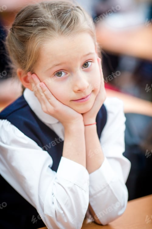Preview: Portrait of adorable little school girl in class